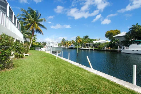 a view of a lake with a house in the background