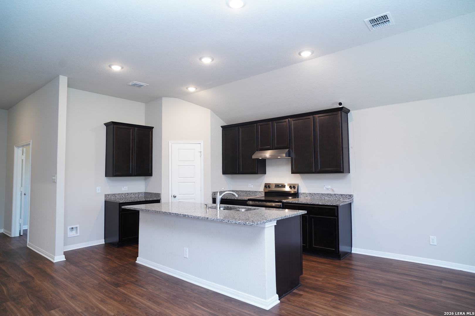 20929 Pleasanton Road San Antonio, TX 78264 - Photo 13 of 51 a kitchen with stainless steel appliances a stove top oven a sink a refrigerator and a microwave