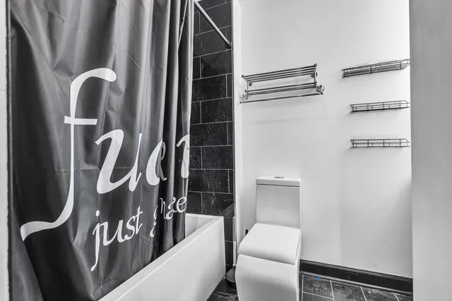 a close view of a utility room with sink dryer and washer