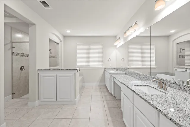 a bathroom with a tub and a window