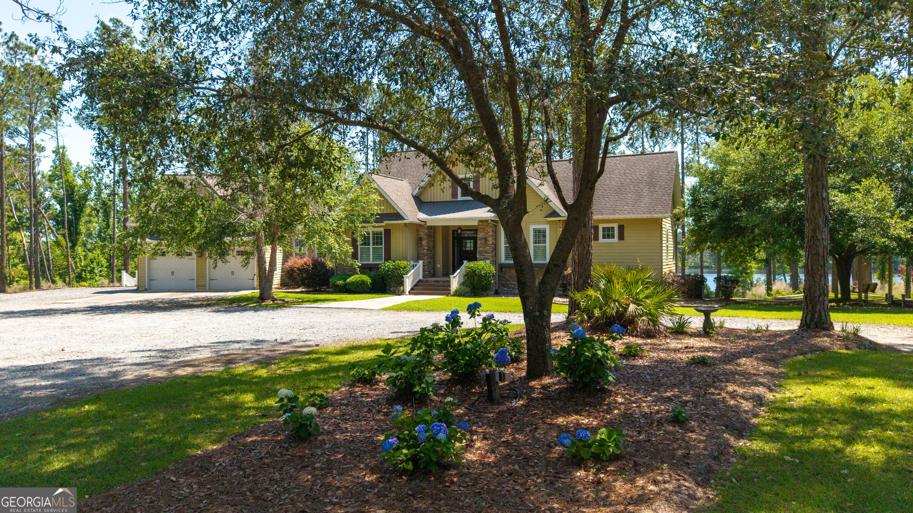 300 Hammond Powell Road Hazlehurst, GA 31539 - Photo 90 of 91 a view of a house with a yard and tree s