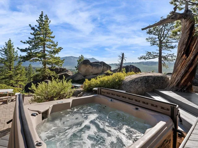 a view of a backyard with sitting area