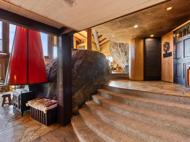 a living room with a couch and a lamp