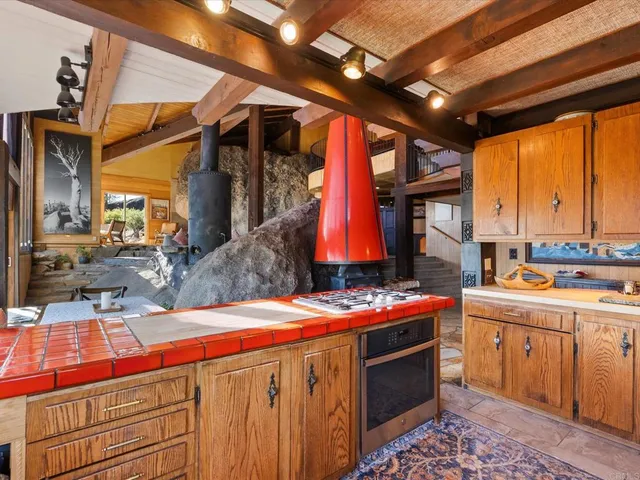 a kitchen that has a sink and a stove