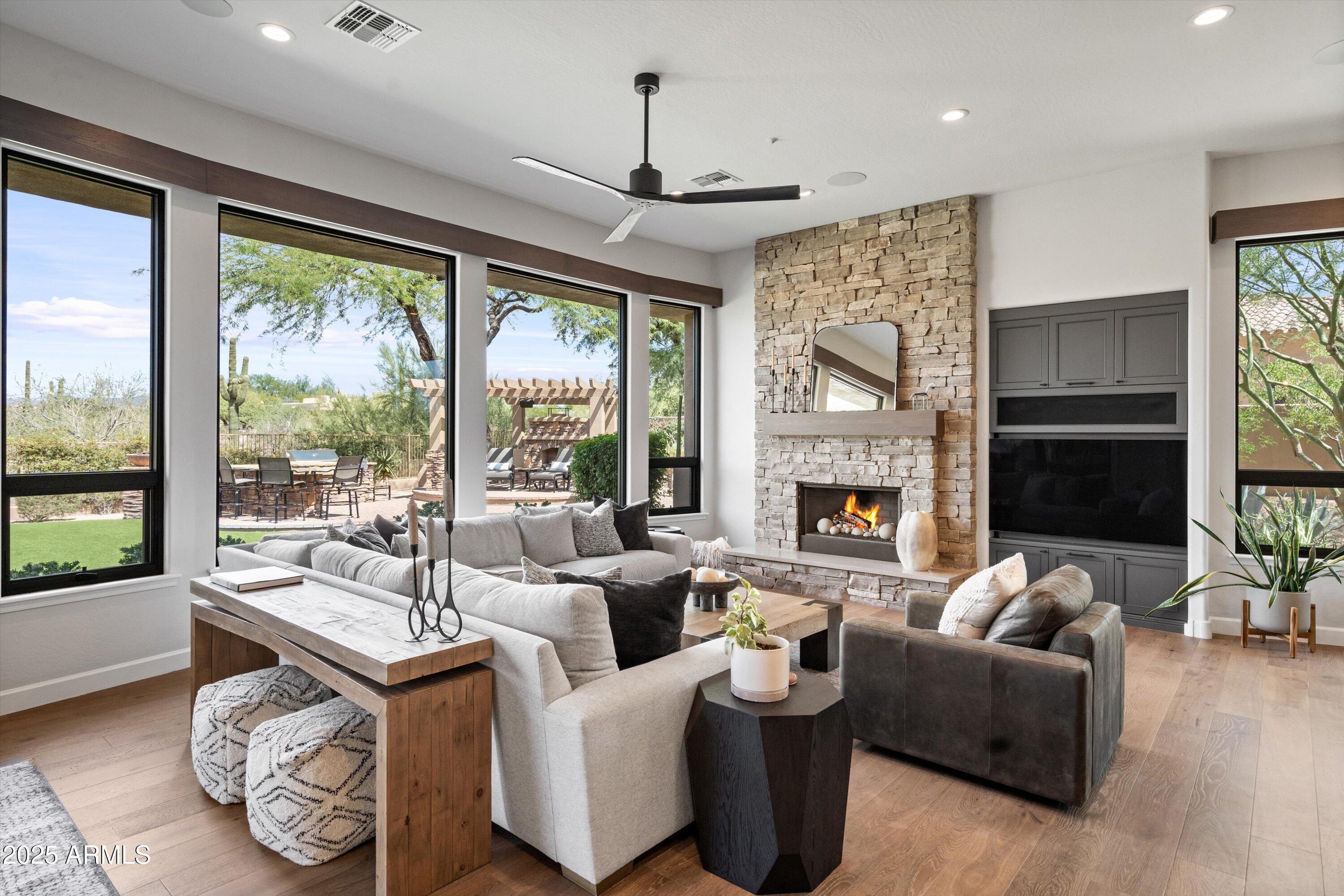7080 East Balancing Rock Road Scottsdale, AZ 85266 - Photo 22 of 99 a living room with furniture and a fireplace