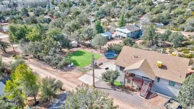 an aerial view of a house with a yard