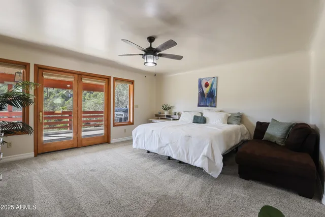 a spacious bedroom with a bed and a walk in closet