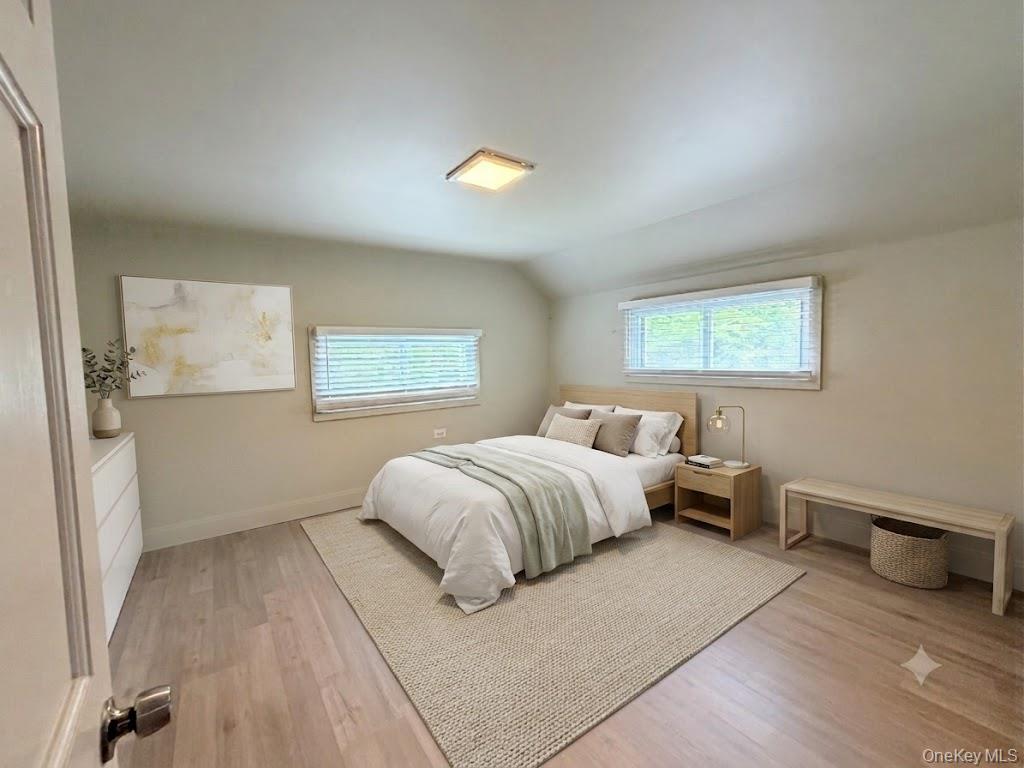 4 Lower Trinity Pass Road Pound Ridge, NY 10576 - Photo 27 of 29 a bedroom with a bed and wooden floor