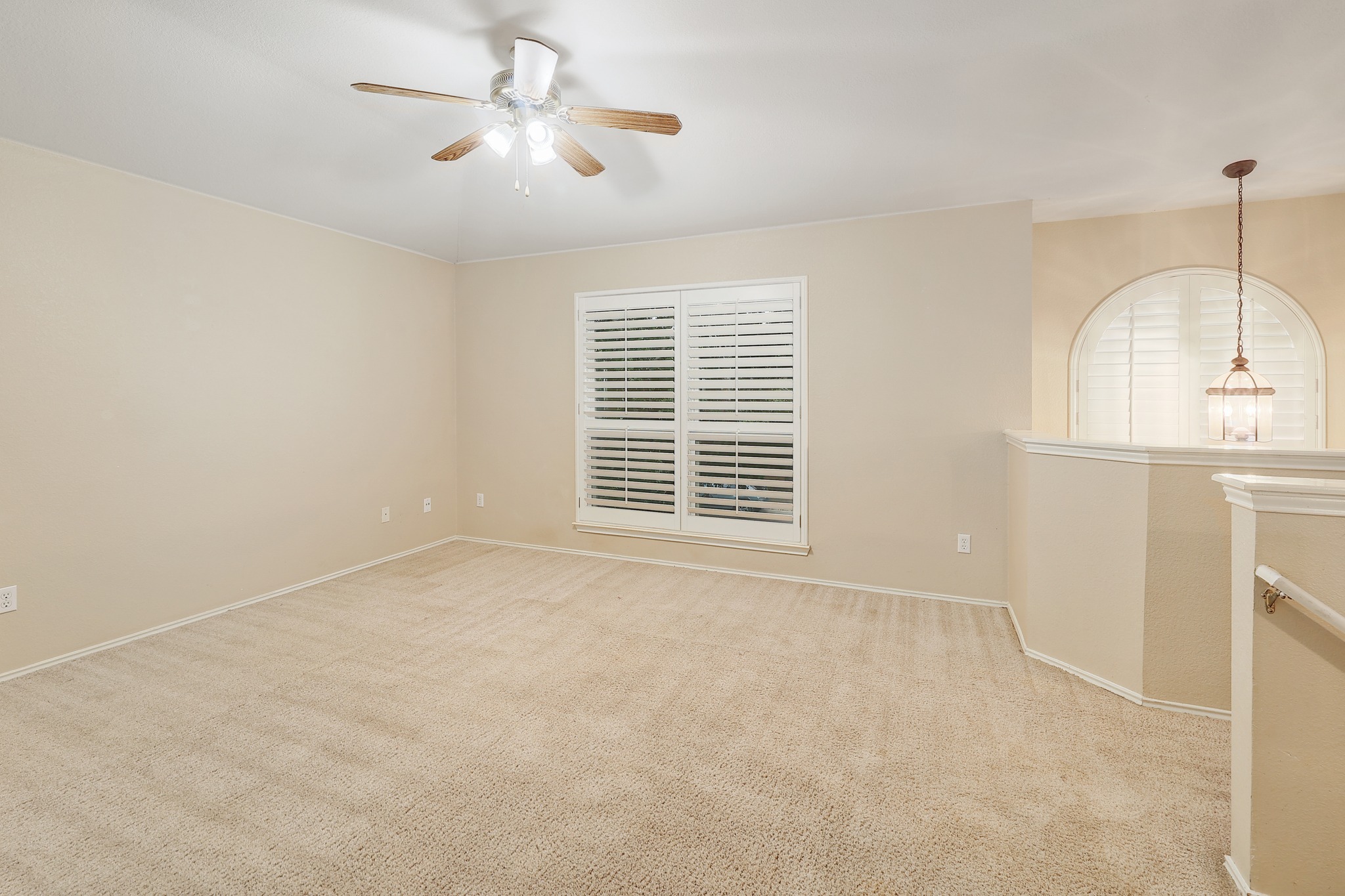 4615 Tello Path Austin, TX 78749 - Photo 15 of 31 Plush carpeted flooring and classic plantation shutters define this versatile upper-level loft area.