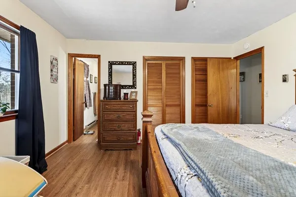 a bedroom with a bed and a dresser