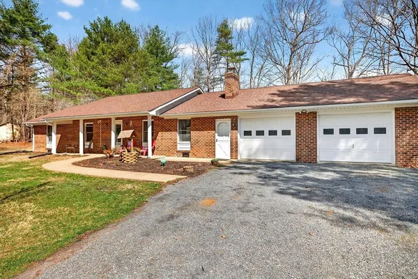 a house with a tree in front of it
