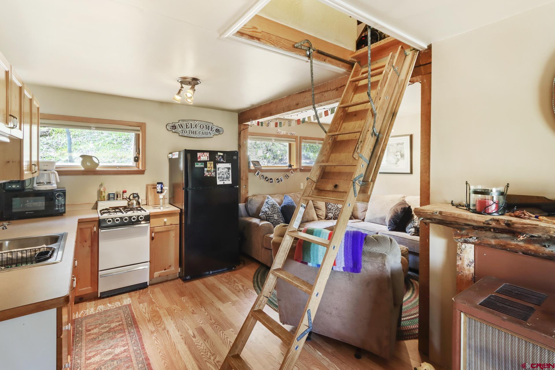 435 Soul's Ease Road Pitkin, CO 81241 - Photo 16 of 35 Pull-down ladder for upstairs access. Don't need it at the time? No problem, tuck it out of the way!