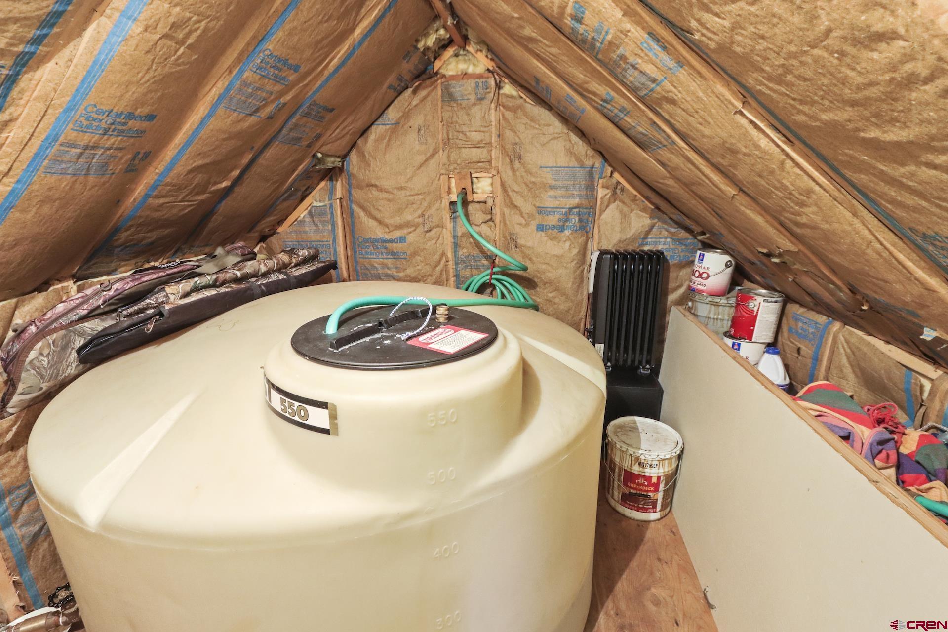 435 Soul's Ease Road Pitkin, CO 81241 - Photo 23 of 35 Water holding tank, water pressure tank and storage space upstairs.