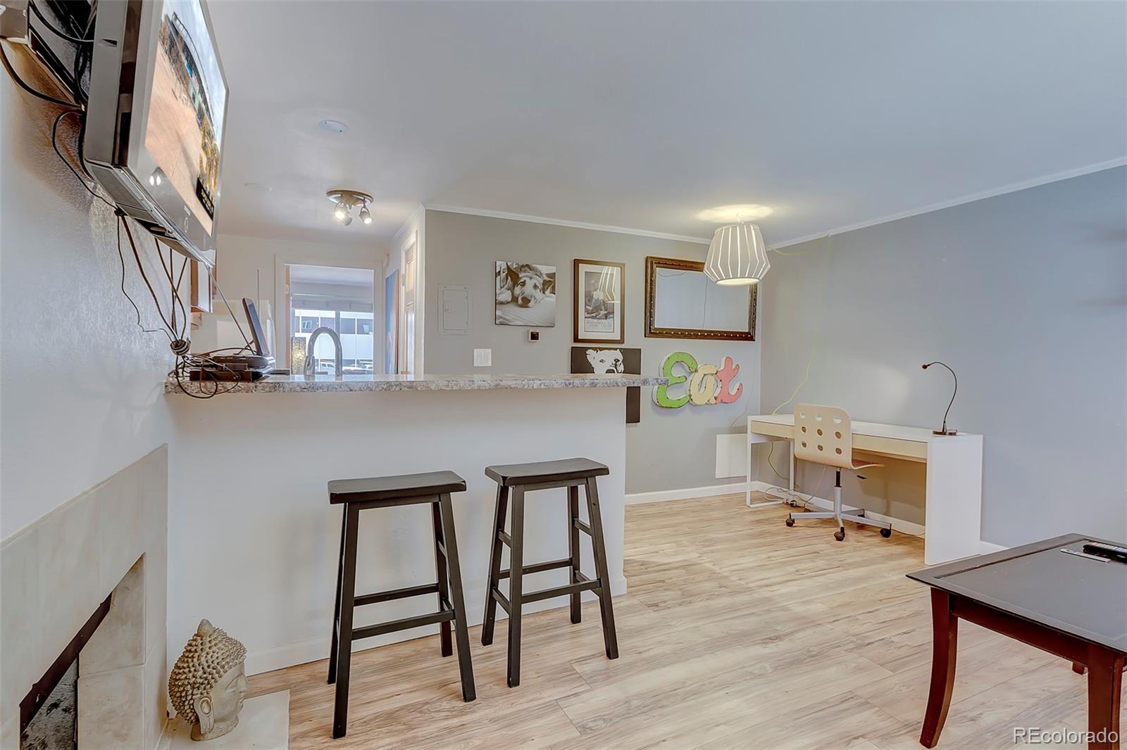 336 Grant Street, Unit 102 Denver, CO 80203 - Photo 1 of 22 a workspace with furniture and window