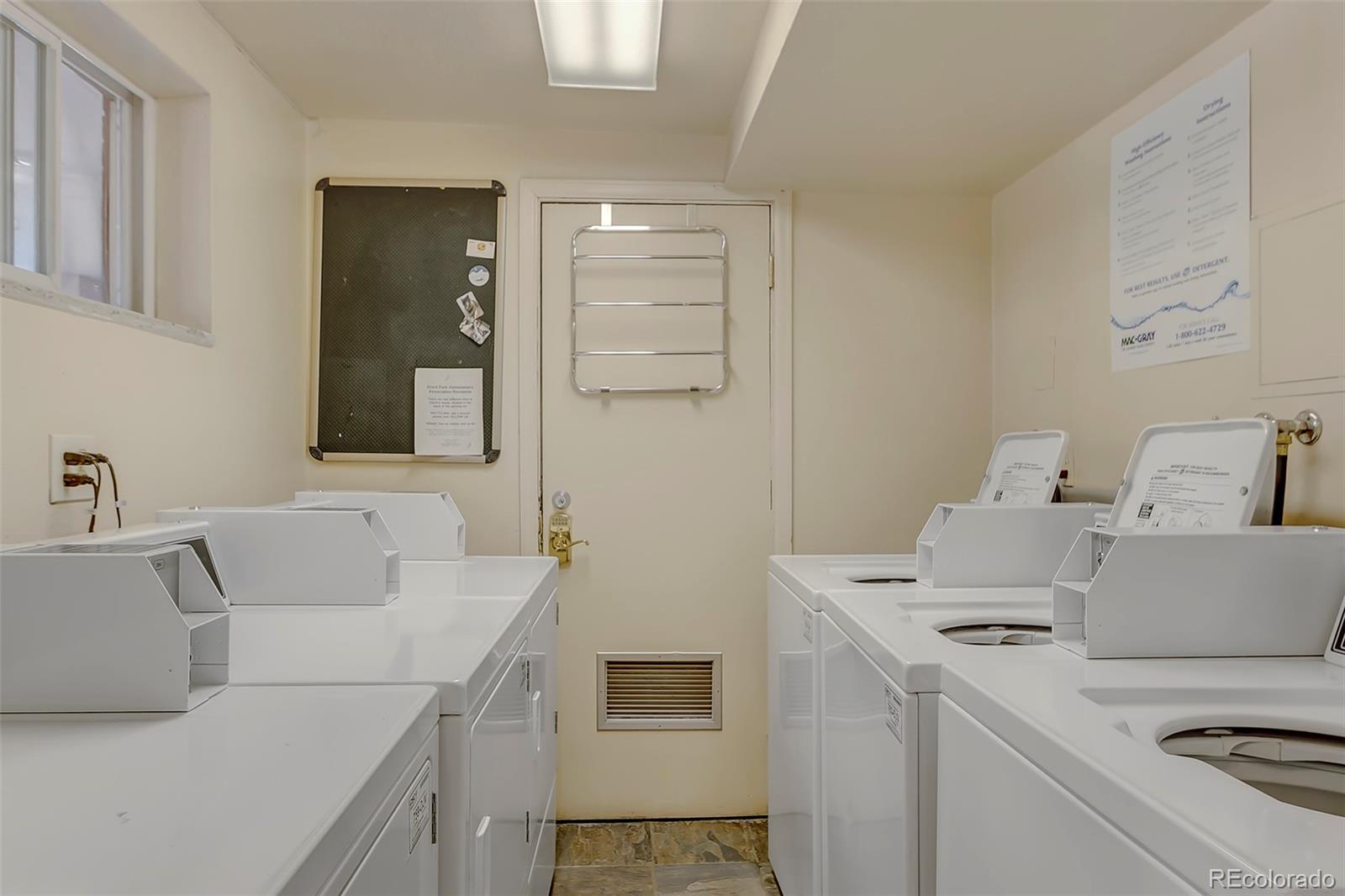 336 Grant Street, Unit 102 Denver, CO 80203 - Photo 18 of 22 a bathroom with a sink and a washing machine