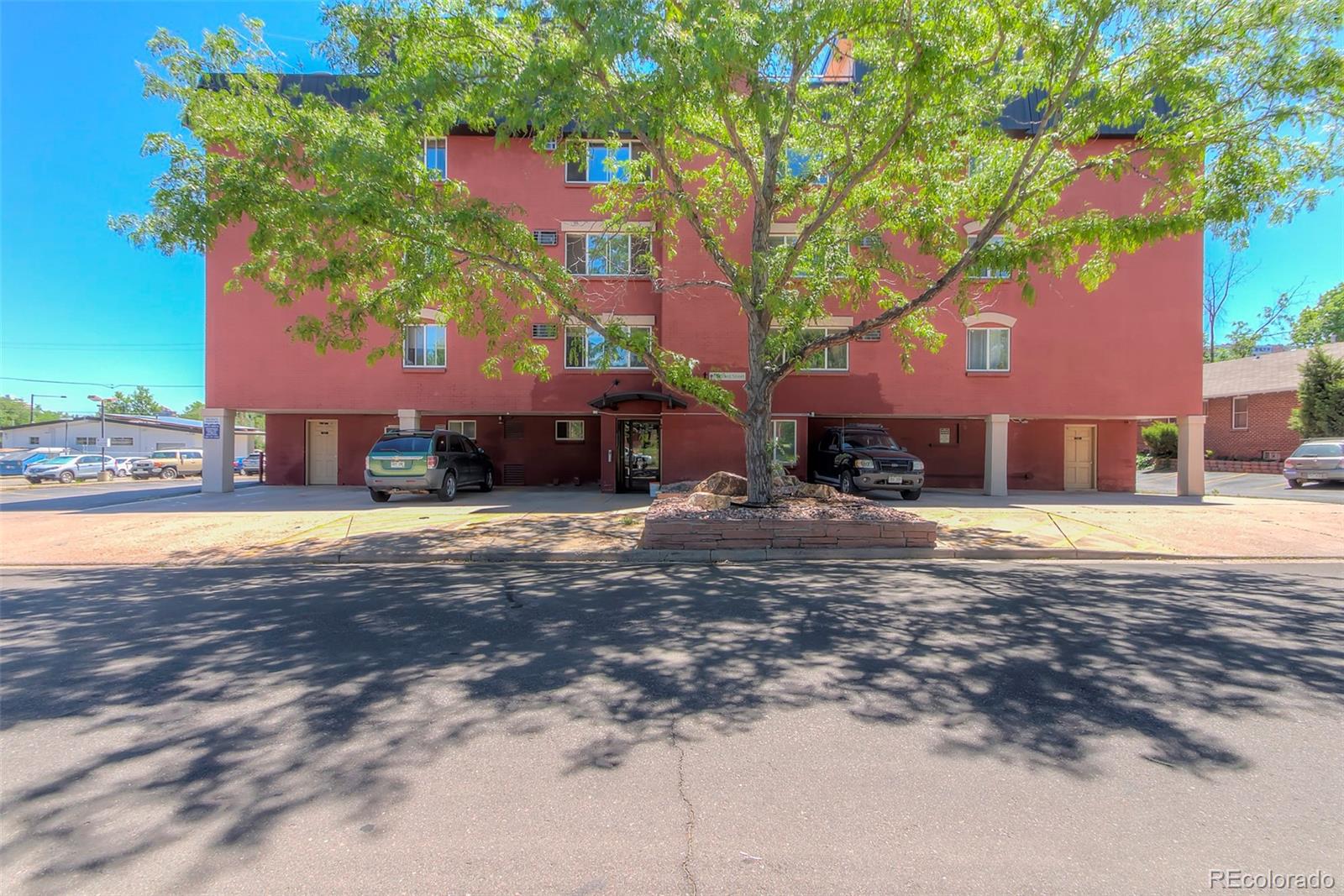 336 Grant Street, Unit 102 Denver, CO 80203 - Photo 21 of 22 a view of a house with a yard