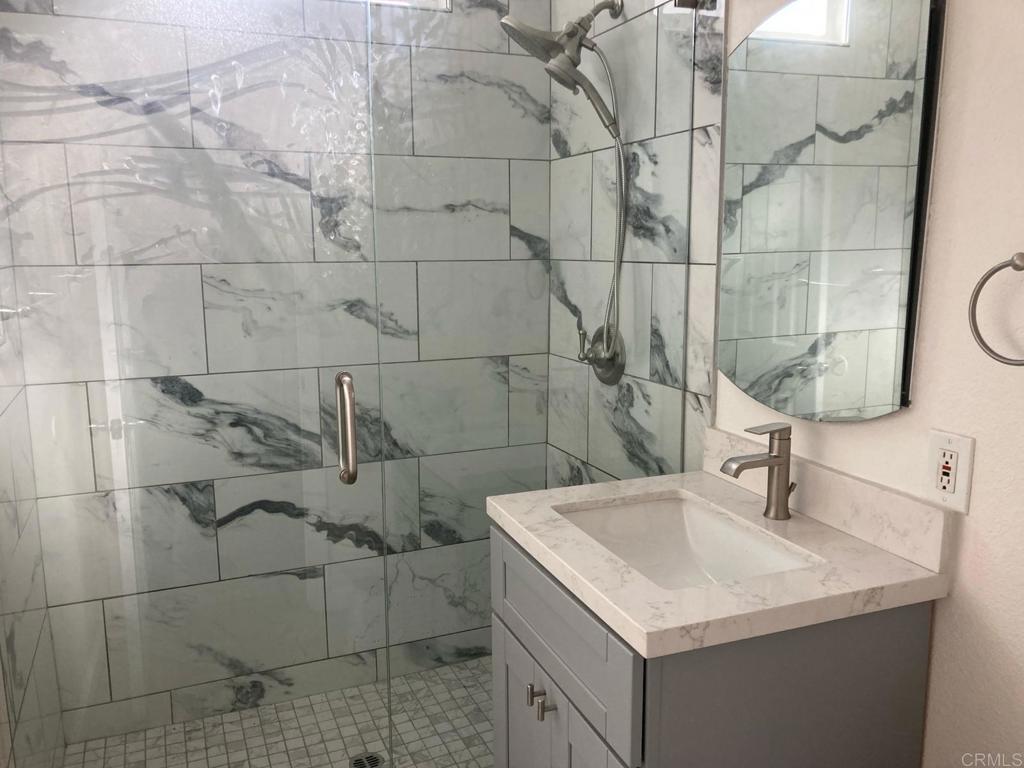 8615 Placid View Drive, Unit A Santee, CA 92071 - Photo 8 of 36 a bathroom with a sink shower and a mirror
