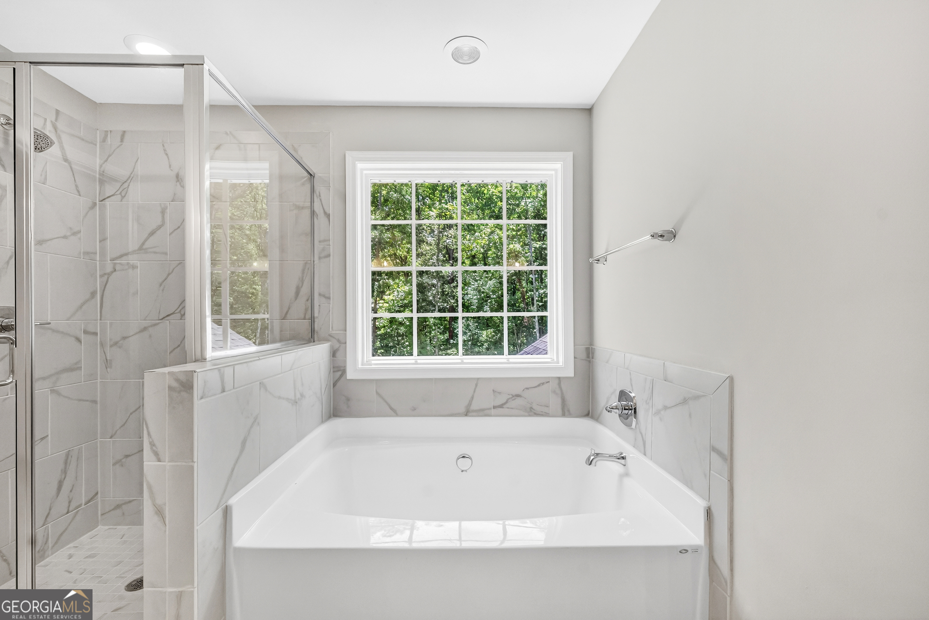 38 Oak Ridge Drive, Unit 26 Waverly Hall, GA 31831 - Photo 5 of 37 a bathroom with a bathtub and shower