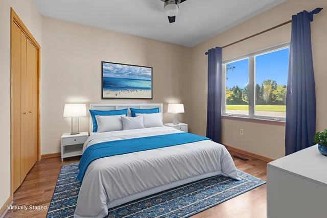 a bedroom with bed and window