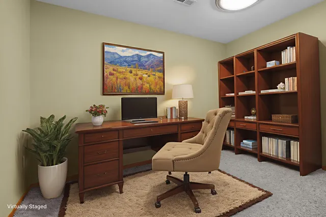 a workspace with furniture and a potted plant