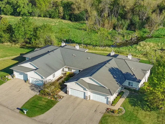 an aerial view of a house with pool outdoor seating and yard