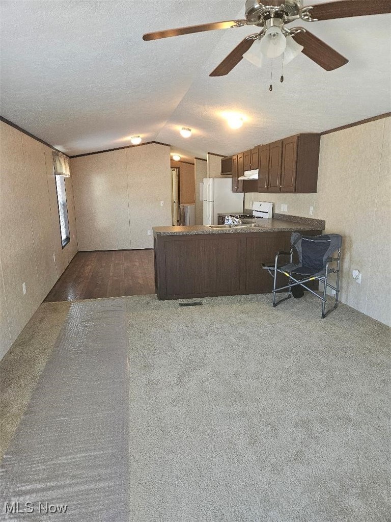6610 Lear Nagle Road, Unit 108 North Ridgeville, OH 44039 - Photo 5 of 23 Living room onto kitchen