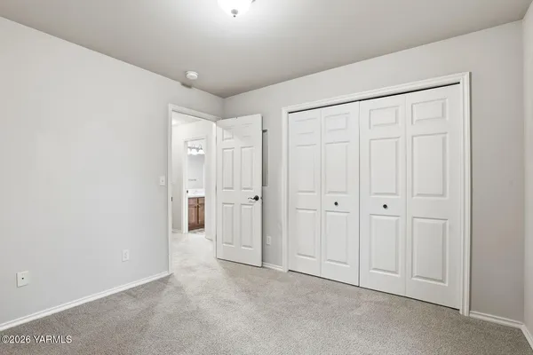 an empty room with a bathroom