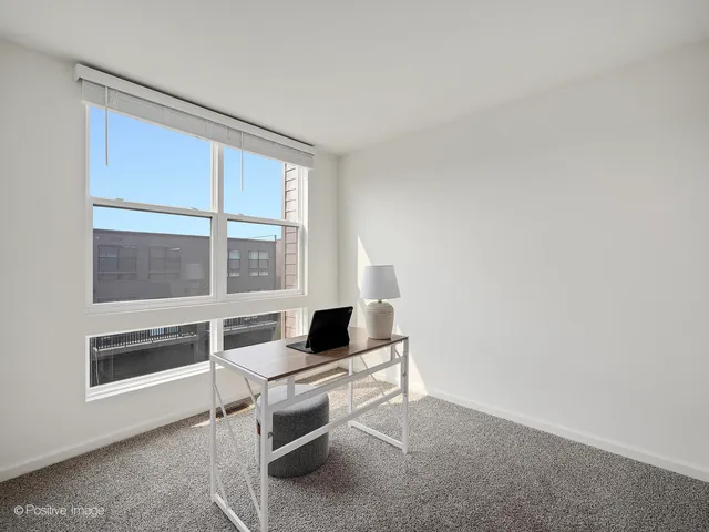 a living room with a couch and a window