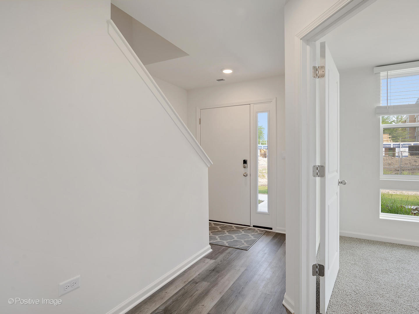 317 Summit Circle Lombard, IL 60148 - Photo 5 of 29 a view of an empty room with wooden floor and windows