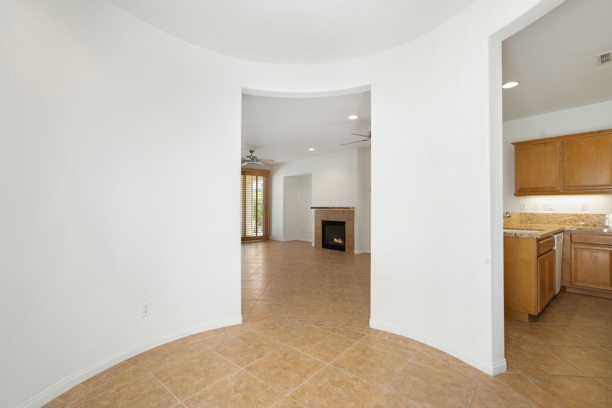 49728 Pacino Street Indio, CA 92201 - Photo 12 of 54 a view of a hallway with a kitchen