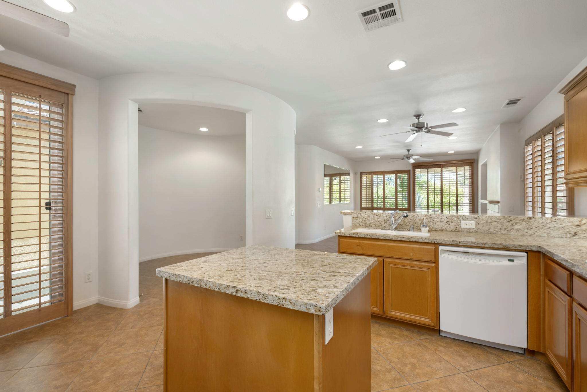 49728 Pacino Street Indio, CA 92201 - Photo 22 of 54 a kitchen with a sink and cabinets