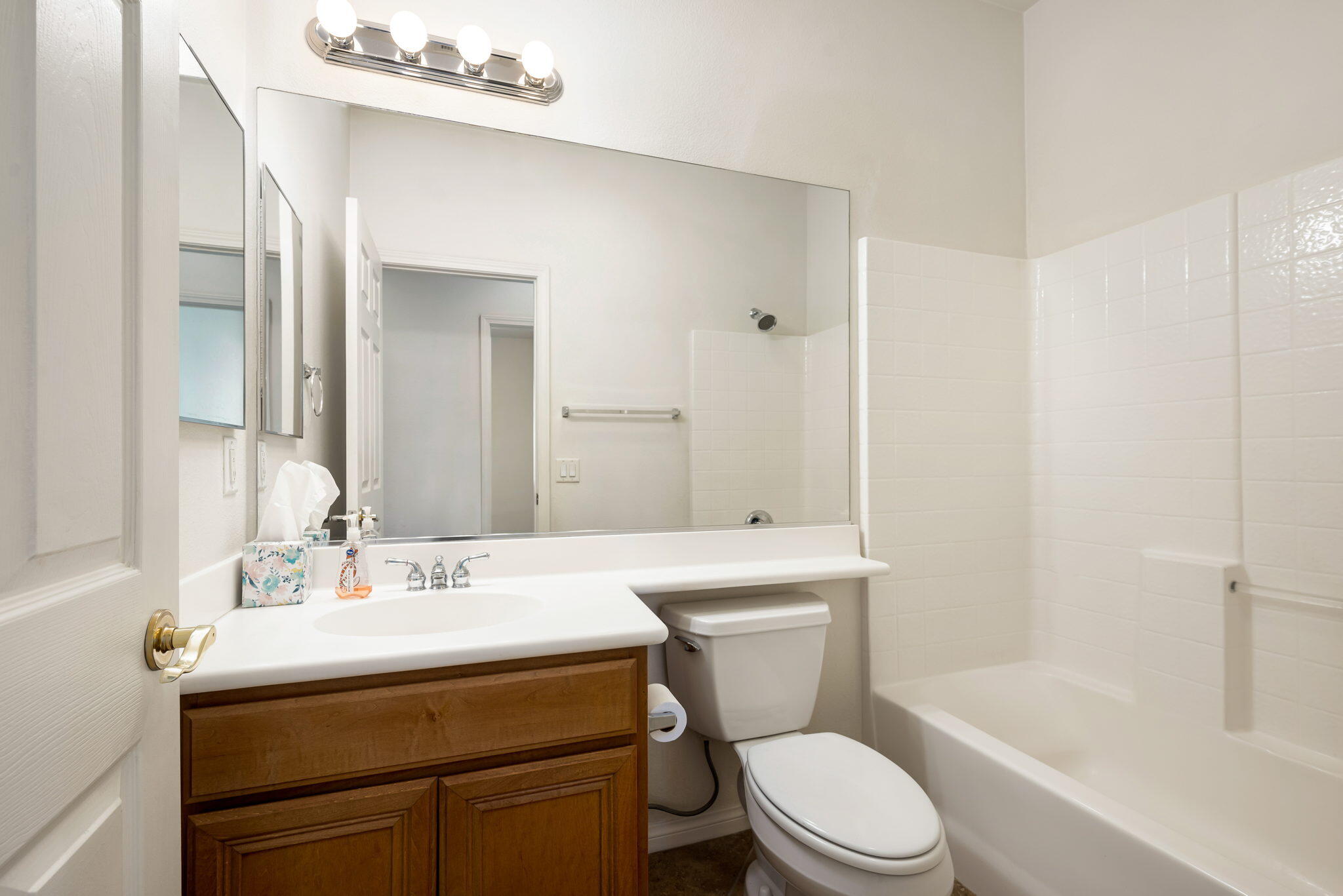 49728 Pacino Street Indio, CA 92201 - Photo 32 of 54 a bathroom with a sink toilet a mirror and shower