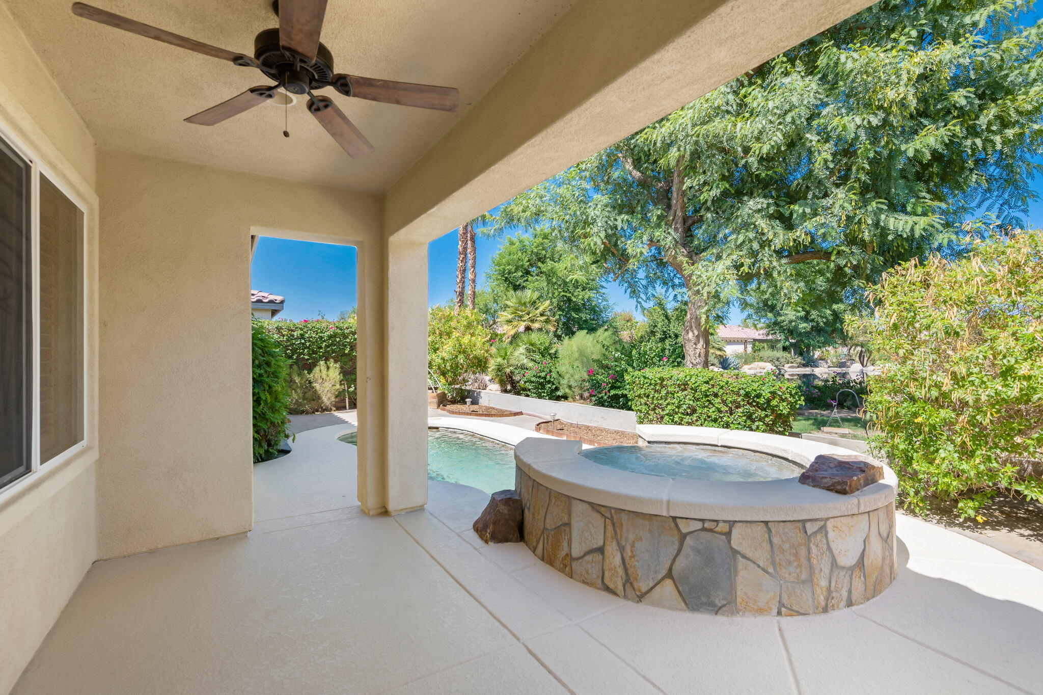 49728 Pacino Street Indio, CA 92201 - Photo 36 of 54 a view of a swimming pool and fire pit