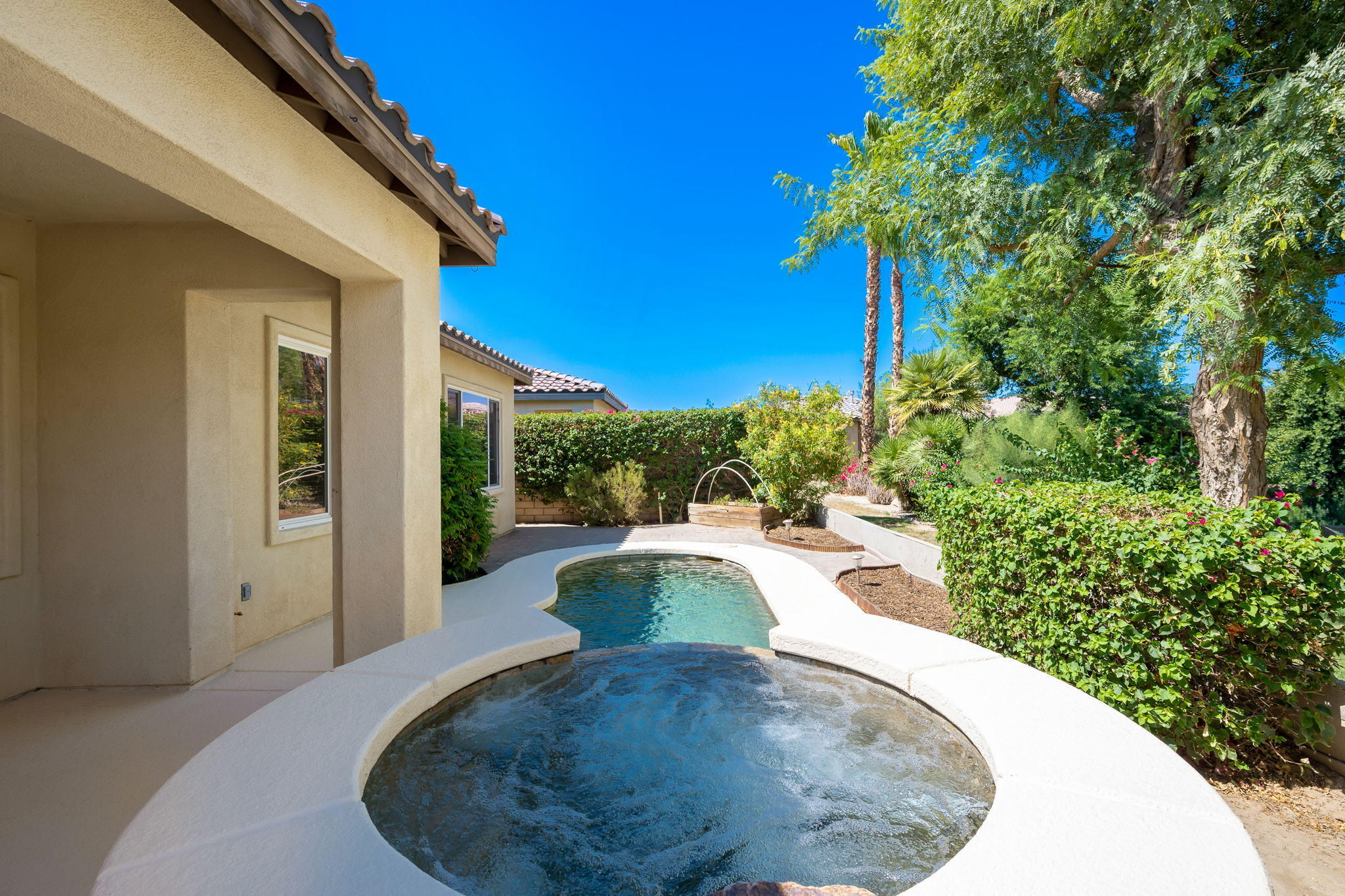 49728 Pacino Street Indio, CA 92201 - Photo 38 of 54 a view of a swimming pool with back yard