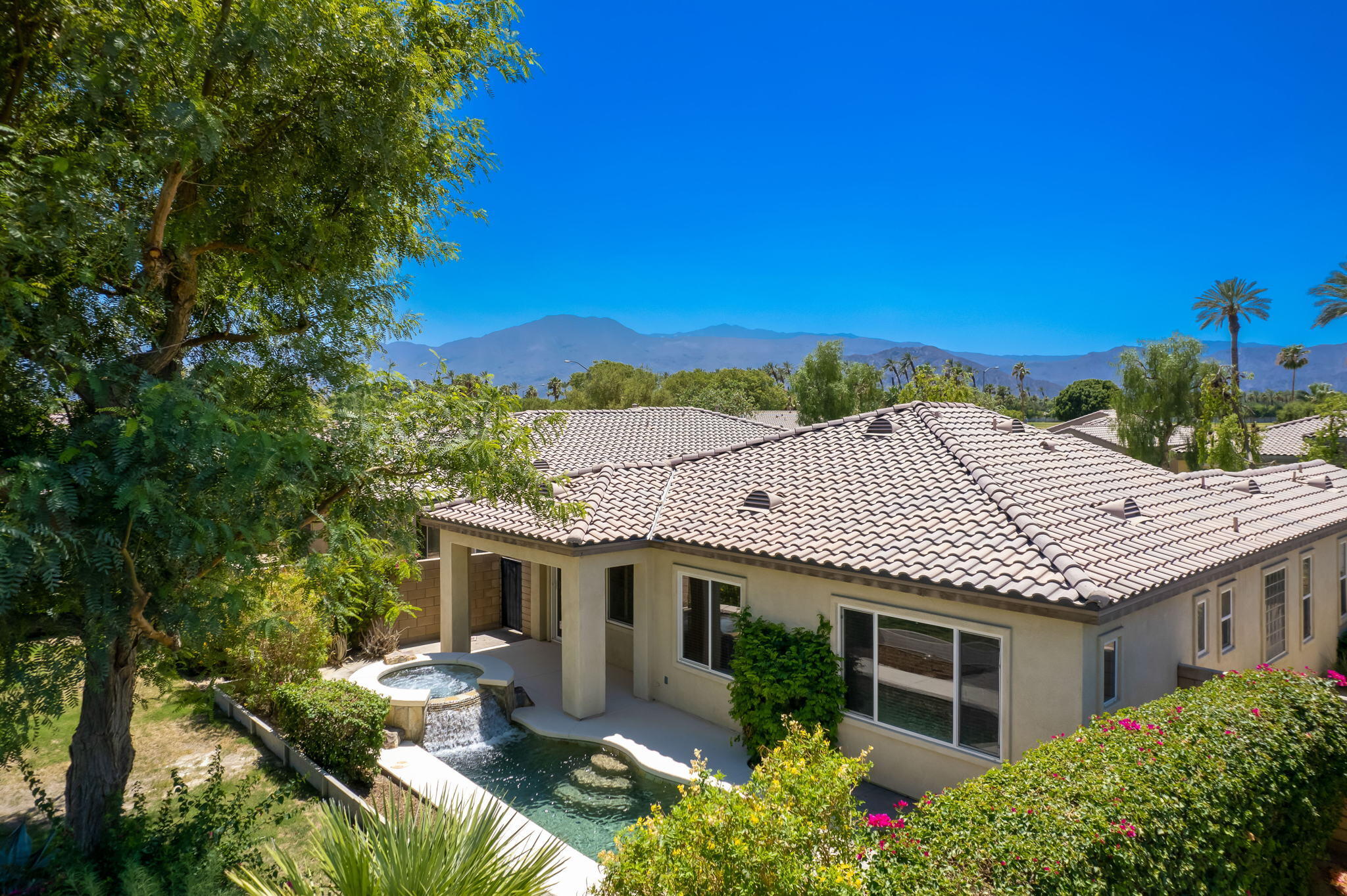 49728 Pacino Street Indio, CA 92201 - Photo 4 of 54 a front view of house with yard and green space