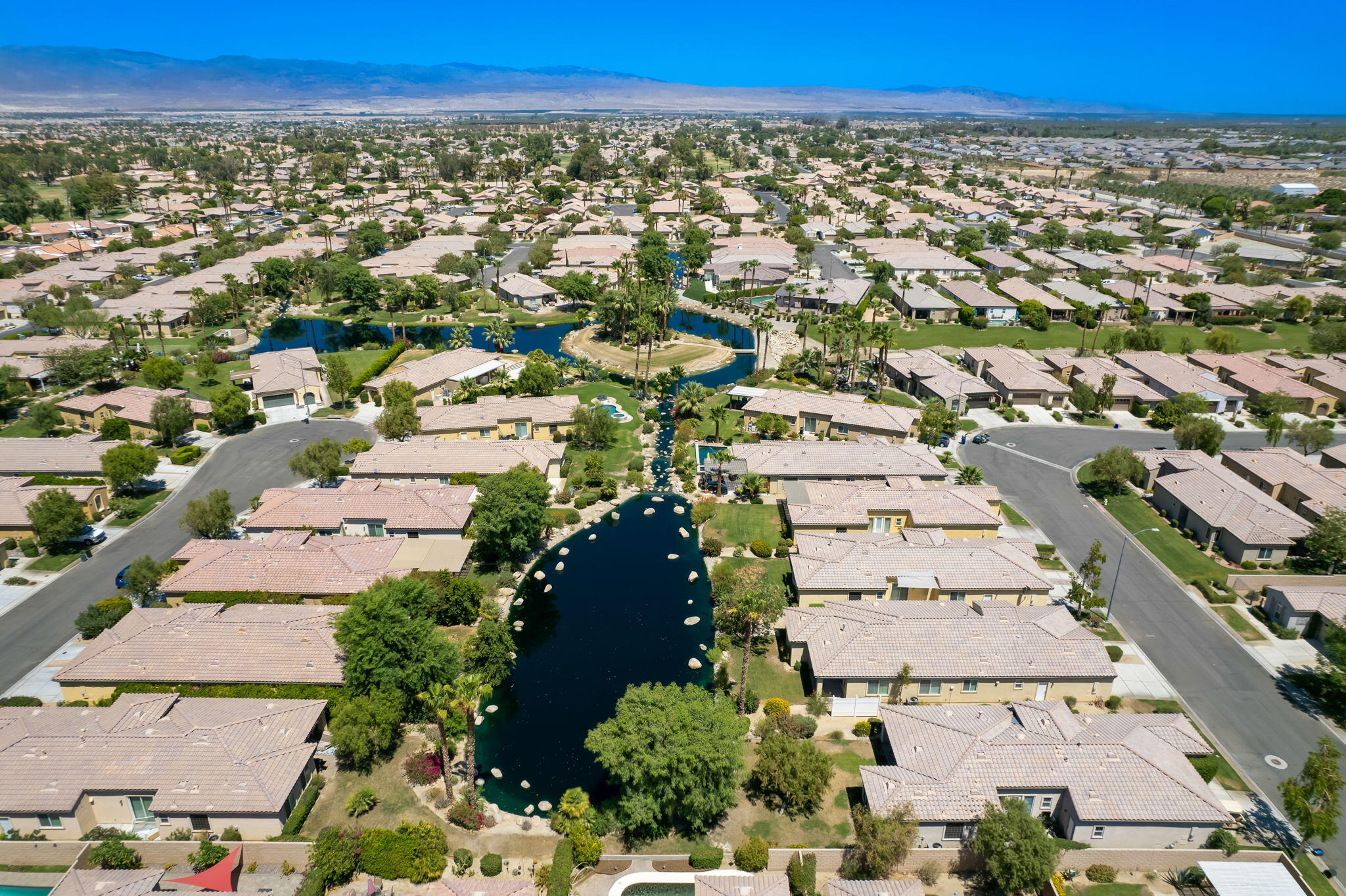 49728 Pacino Street Indio, CA 92201 - Photo 42 of 54 an aerial view of a city with lots of residential buildings