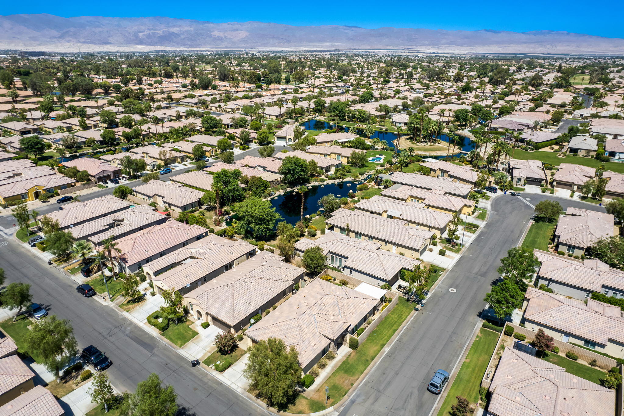49728 Pacino Street Indio, CA 92201 - Photo 45 of 54 an aerial view of residential houses with outdoor space