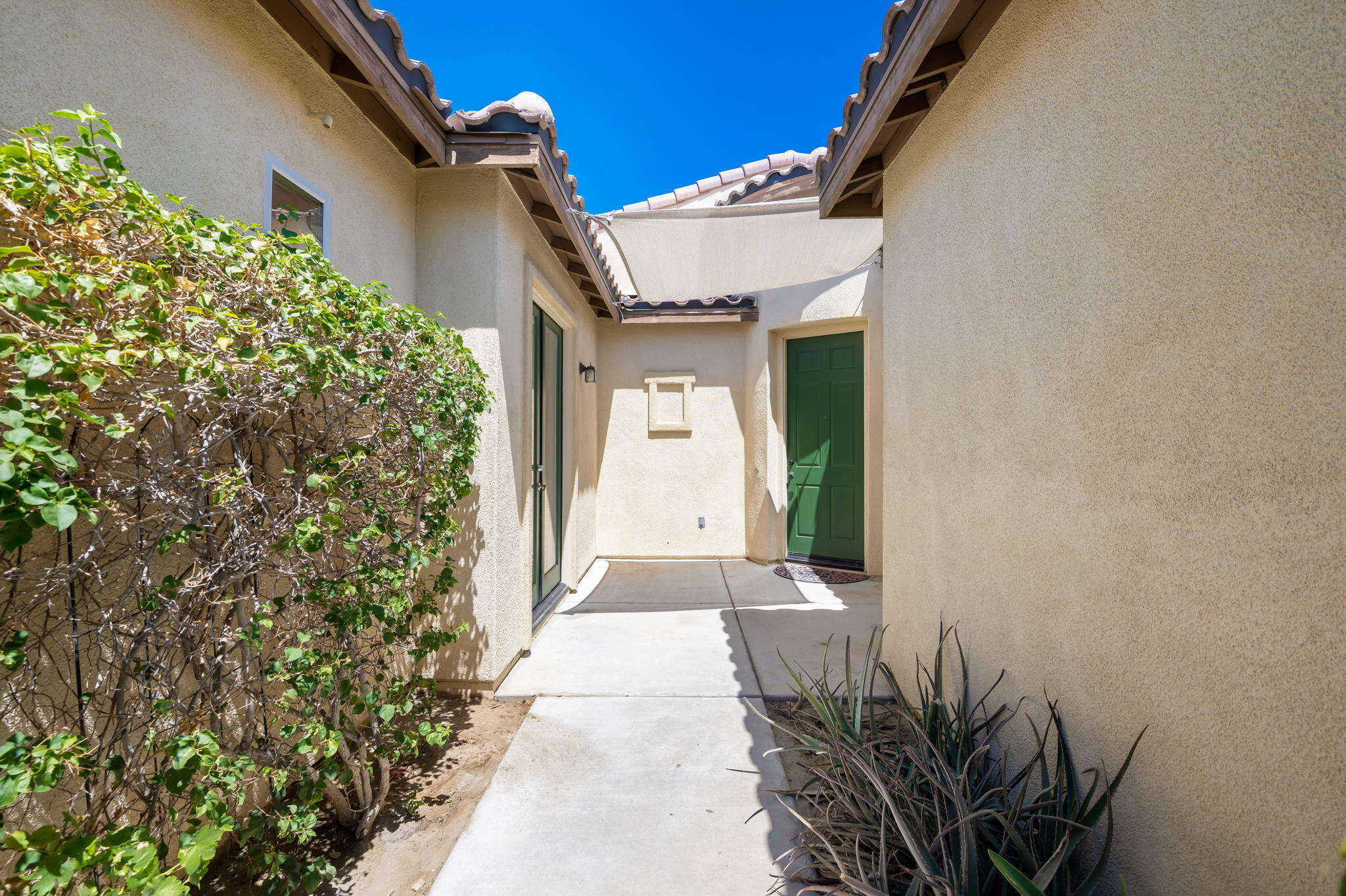 49728 Pacino Street Indio, CA 92201 - Photo 8 of 54 a hallway with windows