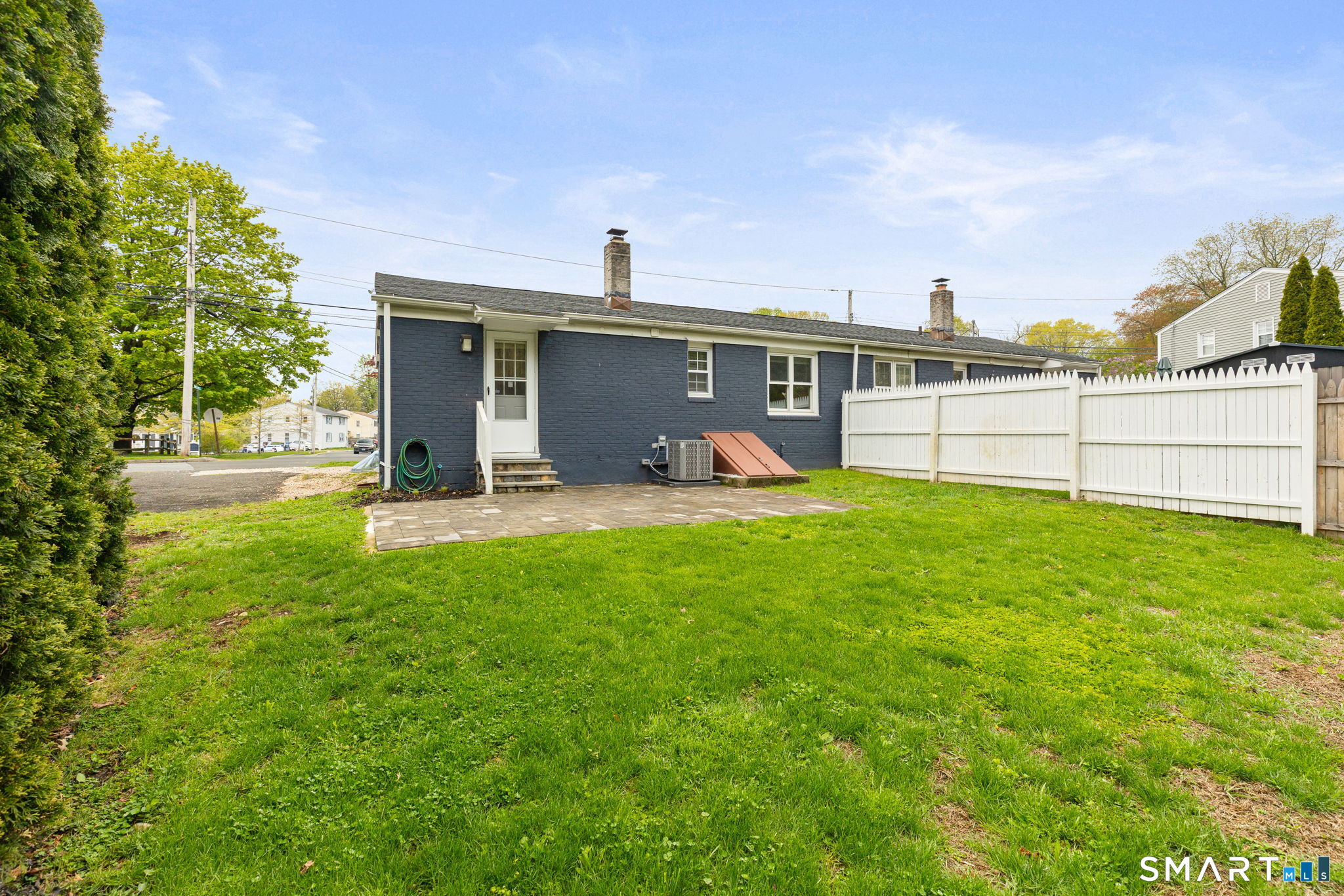 40 Beacon View Drive, Unit 2 Fairfield, CT 06825 - Photo 14 of 18 a view of a house with a yard and sitting area