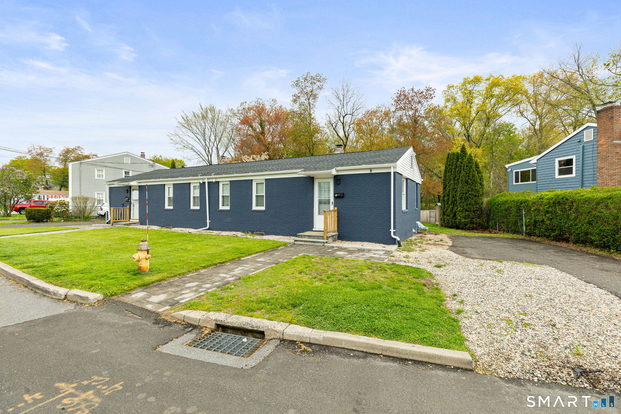 40 Beacon View Drive, Unit 2 Fairfield, CT 06825 - Photo 3 of 18 a view of a house with a swimming pool and a yard