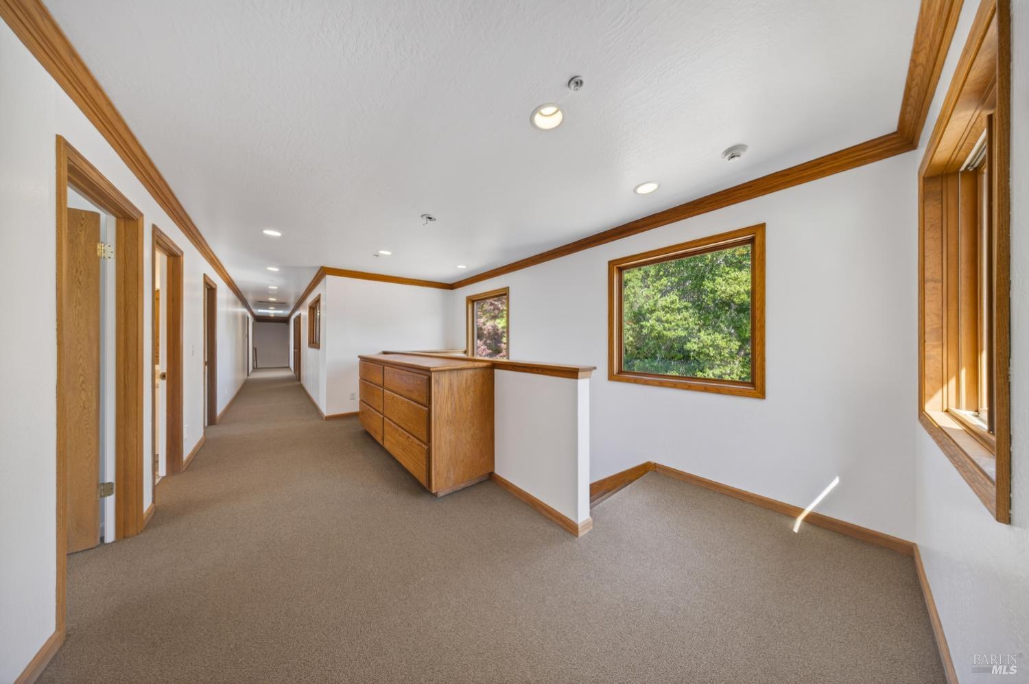 10 Lockton Lane Novato, CA 94945 - Photo 32 of 68 Upper-level landing or flexible bonus area with built-ins, ideal for homework, reading, crafts, or a shared family workspace.