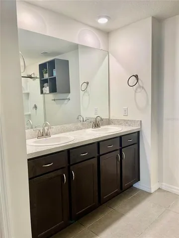 a white toilet sitting next to a small sink