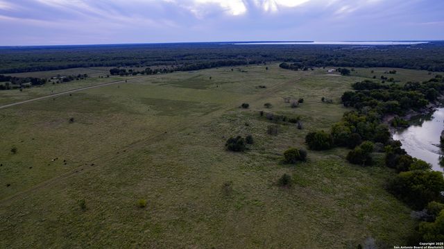 a view of a dry yard with wooden floor and city view