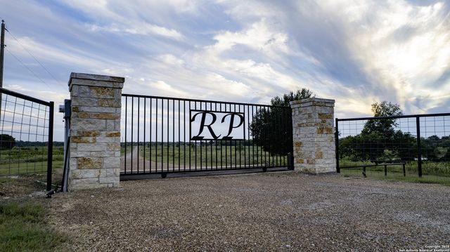 a view of a wrought iron fences in front of house