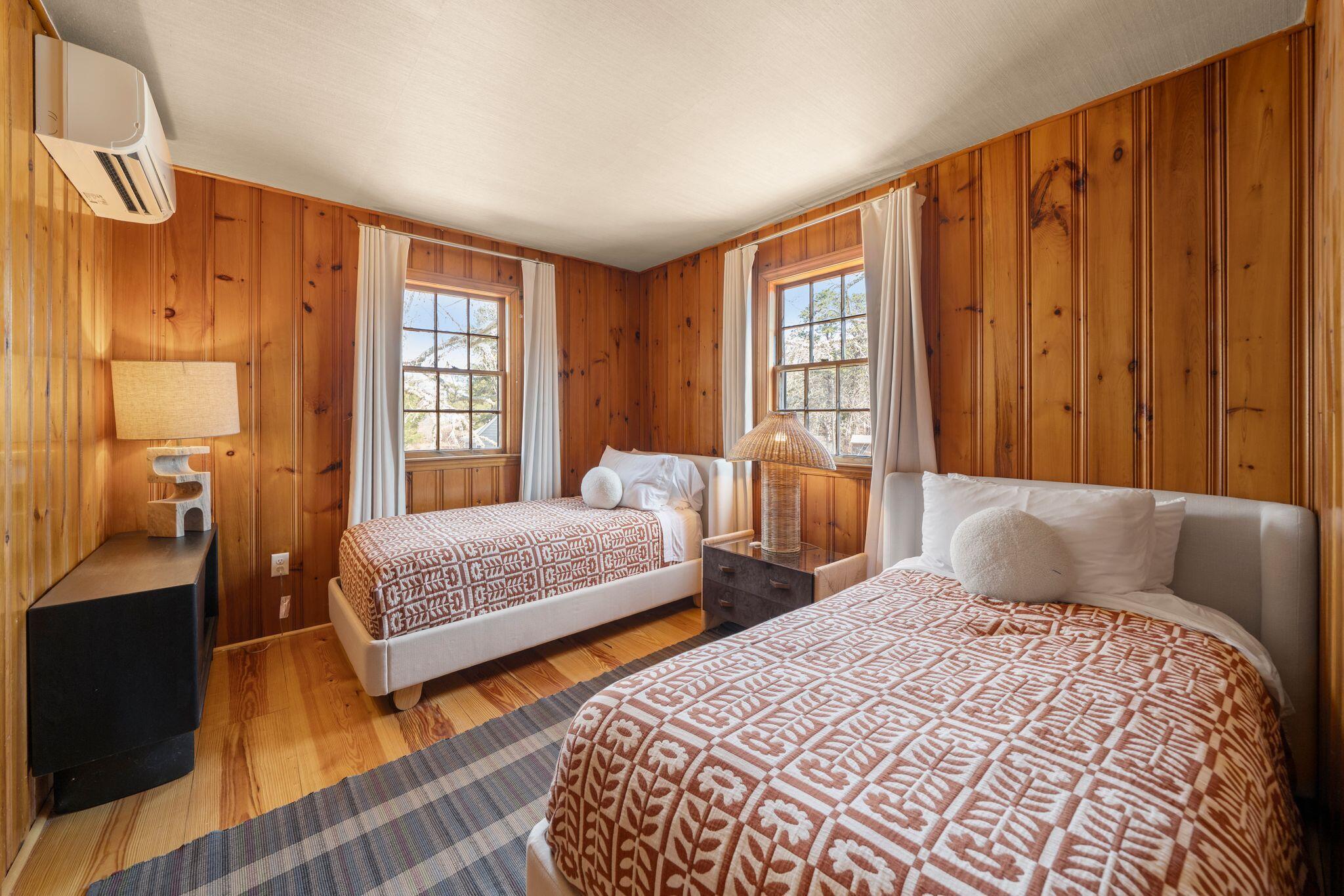 18 Manning Road Dennis Port, MA 02639 - Photo 13 of 34 a bedroom with two beds and a dresser next to a window