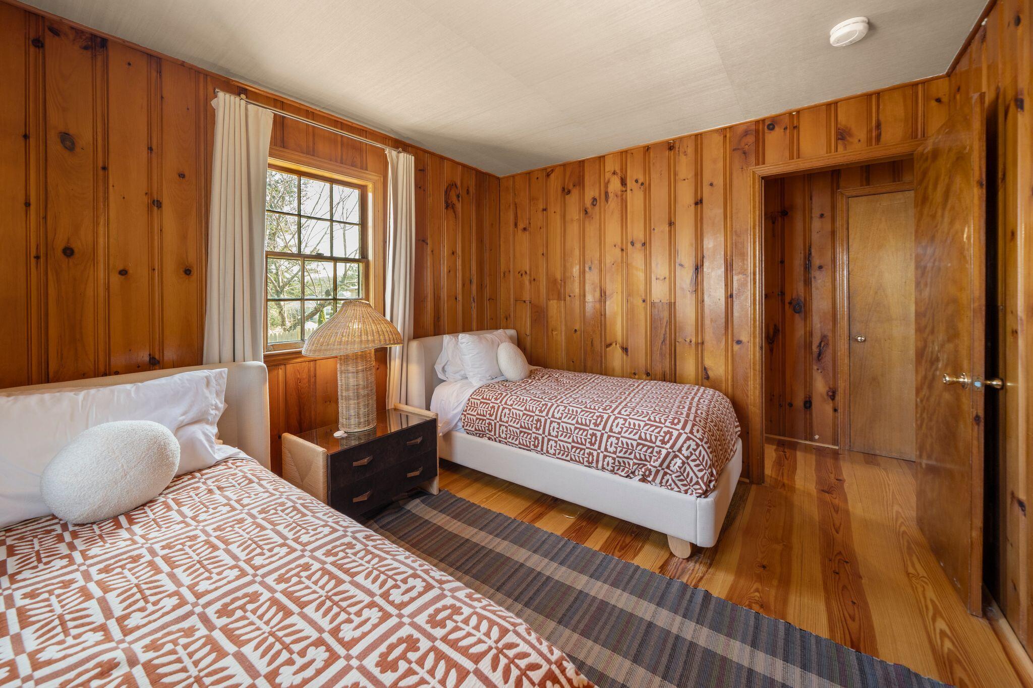 18 Manning Road Dennis Port, MA 02639 - Photo 14 of 34 a bedroom with a bed and wooden floor