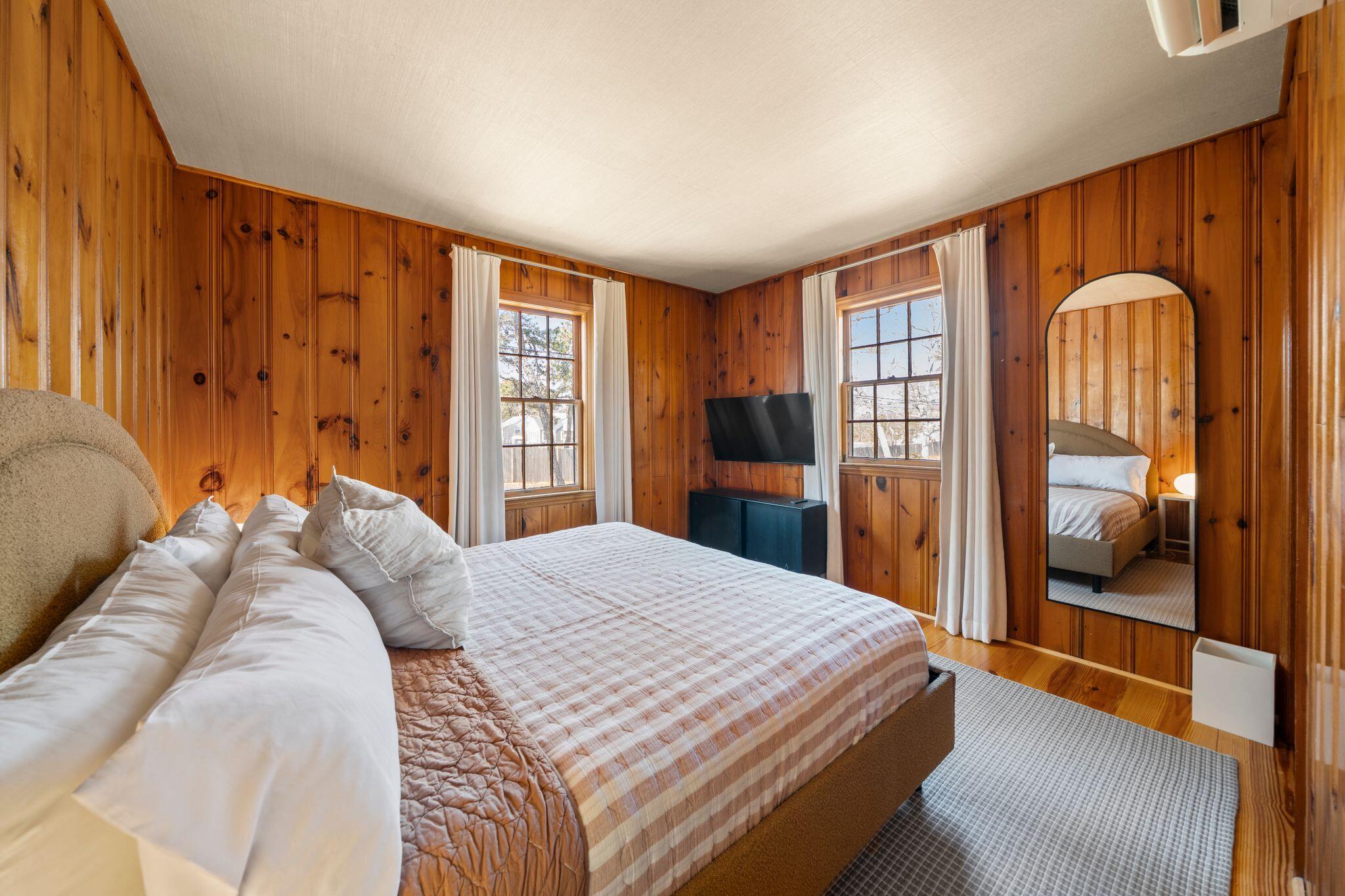 18 Manning Road Dennis Port, MA 02639 - Photo 17 of 34 a bedroom with a large bed and a dresser