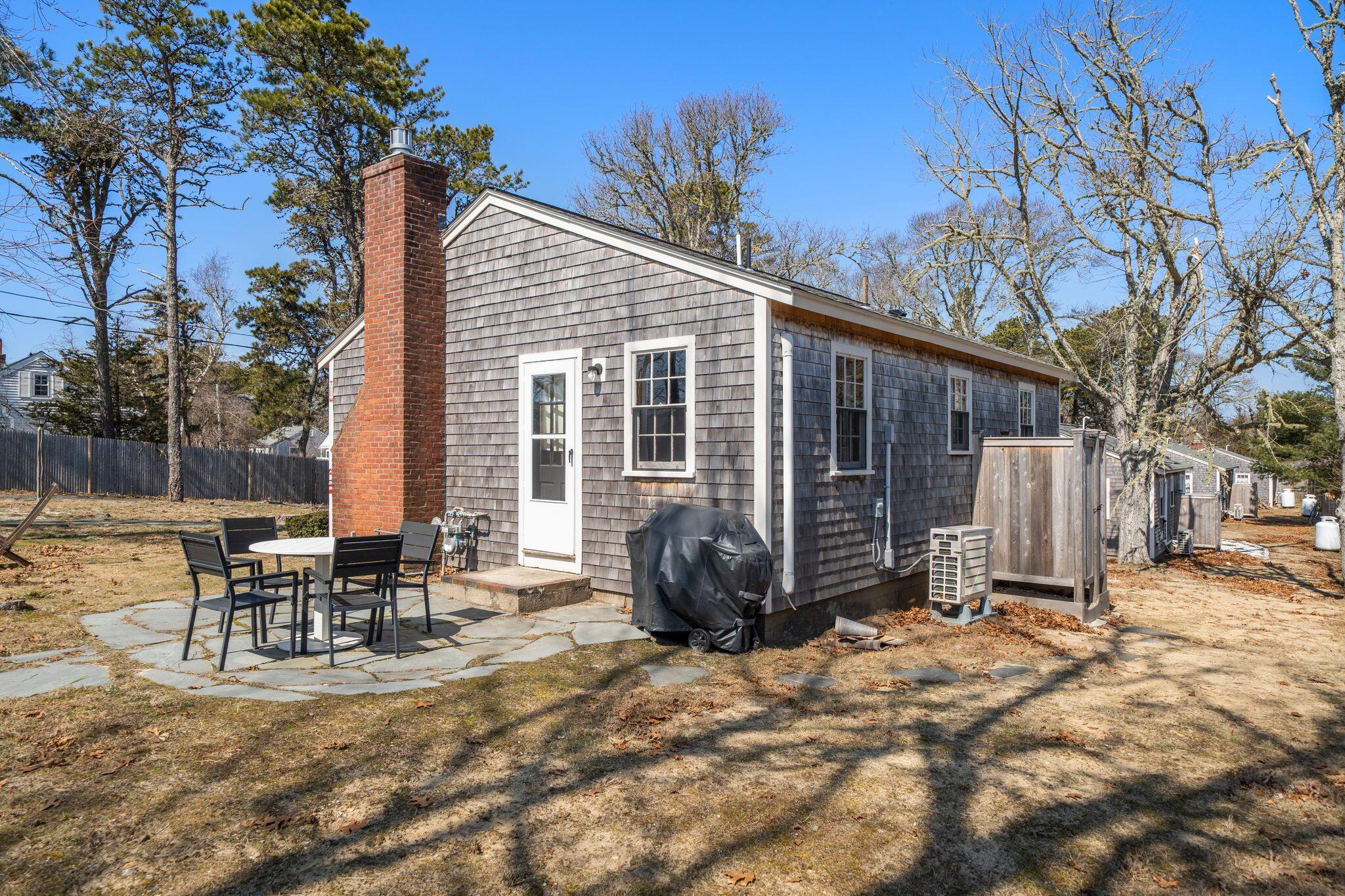 18 Manning Road Dennis Port, MA 02639 - Photo 24 of 34 a view of a house with backyard and sitting area