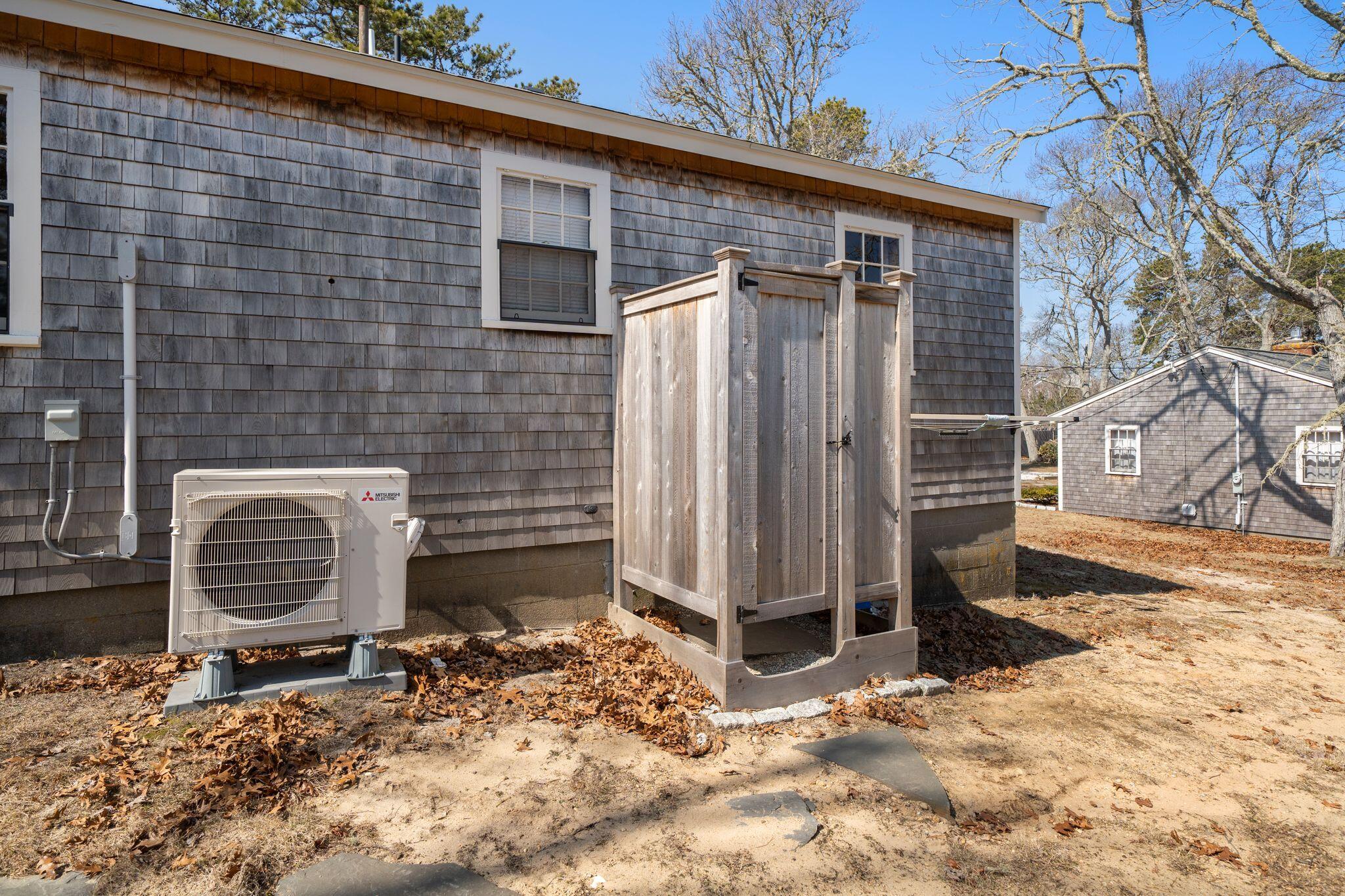 18 Manning Road Dennis Port, MA 02639 - Photo 25 of 34 a backyard of a house with barbeque and wooden fence