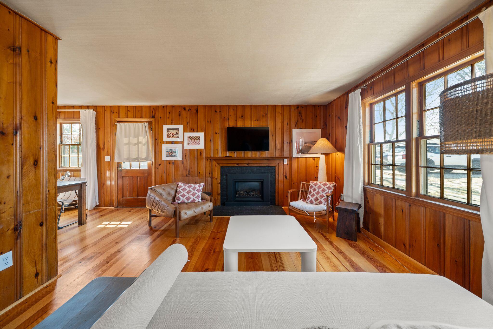 18 Manning Road Dennis Port, MA 02639 - Photo 5 of 34 a living room with furniture fireplace and flat screen tv